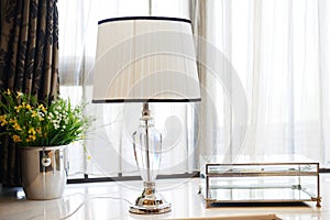 Led table lamp on windowsill