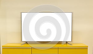 LED TV is located on the table in the living room of the house with a white screen in front view