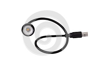 LED USB flashlight in black on a blue background close-up