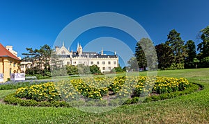 Lednice Chateau with beautiful gardens and parks on sunny summer day