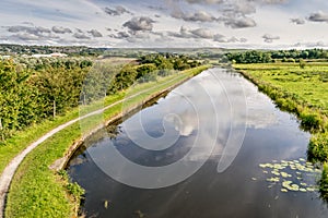 Leeds Liverpool canal with clouds reflecting in the water photo