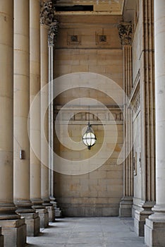 Leeds town hall entrace with stone pillars and Victorian lamp