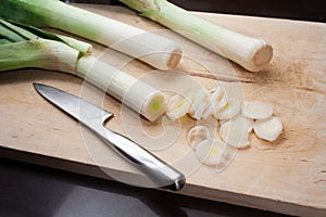 Leeks on a wood cutting board