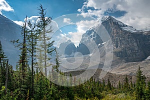 Lefroy Peak in Canadian Rockies lit by sunlight on a partly cloudy day. Mt.Lefroy viewed from the Plain of Six Glaciers trail,