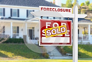 Left Facing Foreclosure Sold For Sale Real Estate Sign in Front