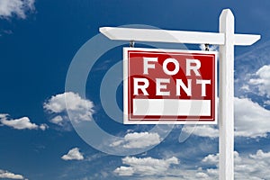 Left Facing For Rent Real Estate Sign Over Blue Sky and Clouds W