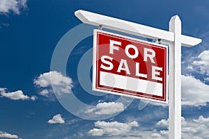 Left Facing For Sale Real Estate Sign Over Blue Sky and Clouds W