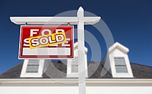 Left Facing Sold For Sale Real Estate Sign In Front of House and