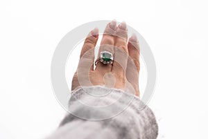 Left hand with Emerald engagement ring