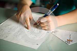 Left handed boy writing photo