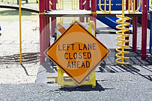 Left lane closed ahead sign