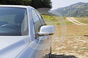 Left part of silver modern sports car