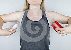 left or right. Girl chooses between eco-friendly deodorant without toxins and antiperspirant with toxic elements. In left hand