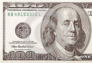 Left side of American 100 dollars bill, 100 bucks, one hundred US dollars bank note. portrait of Benjamin franklin on the largest