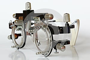 Left side view of trial frame used in ophtalmology and optometry to diagnose and correct refractive errors.