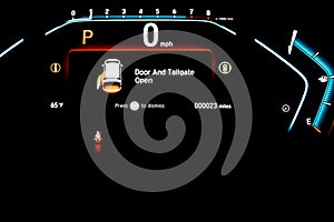 Left sliding rear door open warning on instrument panel or dashboard control of modern minivan car, low milage only 23 miles