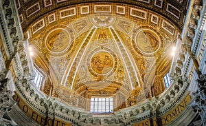 Left transept with amazing golden ceiling in Saint Peters Basilica in Rome, Italy.