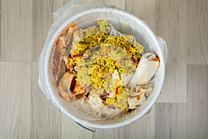 Leftover Food In Trash Bin photo