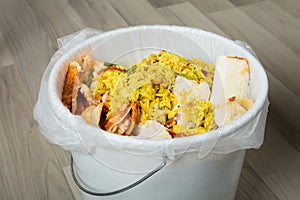 Leftover Food In Trash Bin photo