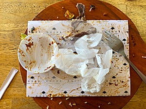 Leftover food and used tissue