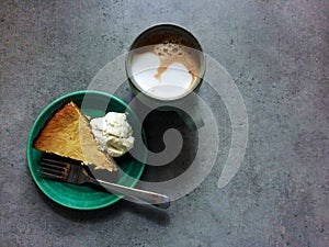 Leftover Thanksgiving pumpkin pie cheesecake and latte for breakfast