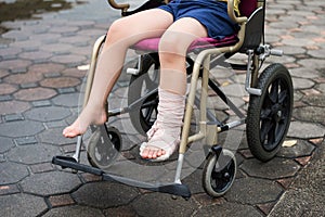 Leg broken boy sit on wheelchair