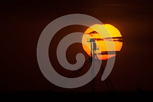 A Leg of a Grain Elevator Silhouetted Against the Setting Sun