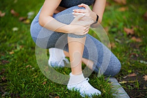 Leg Injury. Beautiful Woman Feeling Pain In Knee