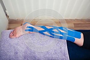 Leg with kinesio tape