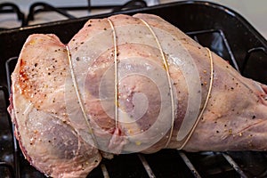 Leg of lamb stuffed and trussed, prepared for roasting