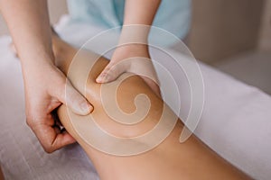 Leg massage close-up. Spa salon self-care relax.