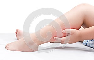 Leg pain or calf muscle in a boy on bed isolated photo