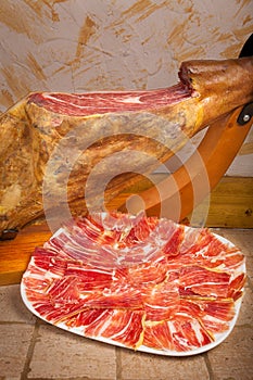 Leg and plate of Spanish jamon iberico