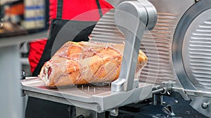 Leg Of Prosciutto Ham. Gourmet Meat Deli, Meat Slicer. photo