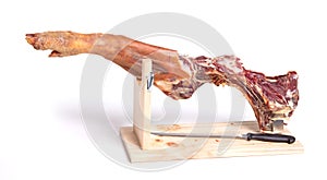 Leg of spanish jamon serrano, dry cured ham, on a white background