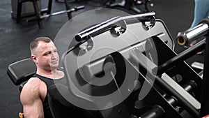 Leg training press man gym machine muscles legs strength center, from weight people from bodybuilder and young two