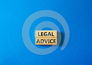 Legal advice symbol. Wooden blocks with words Legal advice. Beautiful blue background. Business and Legal advice concept. Copy