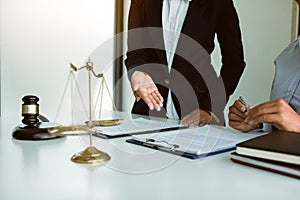 Legal advisor is explaining the offense under the law in the book at office