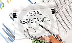 LEGAL ASSISTENCE text on the chart , office supplies, business concept