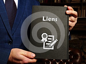 Legal concept meaning Liens with sign on the sheet