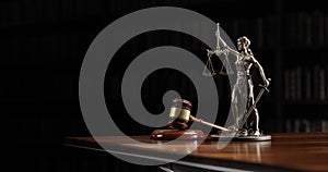 Legal Concept: Themis is the goddess of justice and the judge's gavel hammer as a symbol of law and order on the