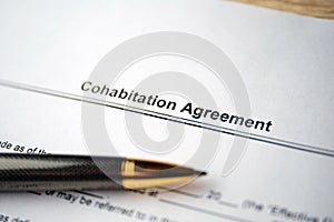 Legal document Cohabitation Agreement on paper with pen photo