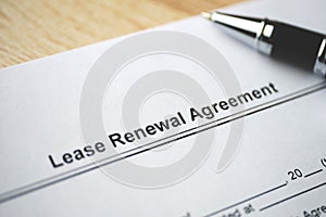 Legal document Lease Renewal Agreement on paper close up photo