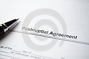 Legal document Postnuptial Agreement on paper with pen