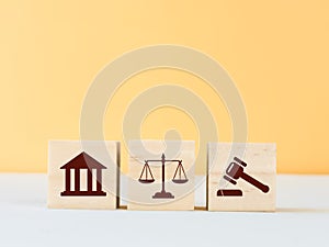 Legal justice symbols on wooden cubes.