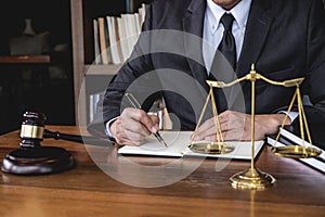 Legal law, advice and justice concept, Judge gavel with Justice lawyers, Counselor in suit or lawyer working on a documents in
