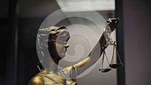 Legal and law concept statue of Lady Justice in office. Move camera footage