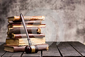 Legal Law and Justice concept - Old law book with a wooden judges gavel on table in a courtroom or law enforcement