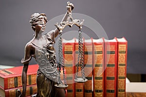 Legal Law and Justice concept - Open law book with a wooden judges gavel on table in a courtroom or law enforcement