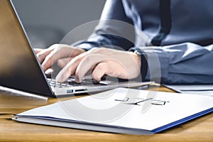 Legal worker in law firm with laptop computer. Attorney, prosecutor or solicitor working on a legislation case. photo